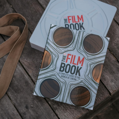 A  Film Book Laid on a Wooden Surface