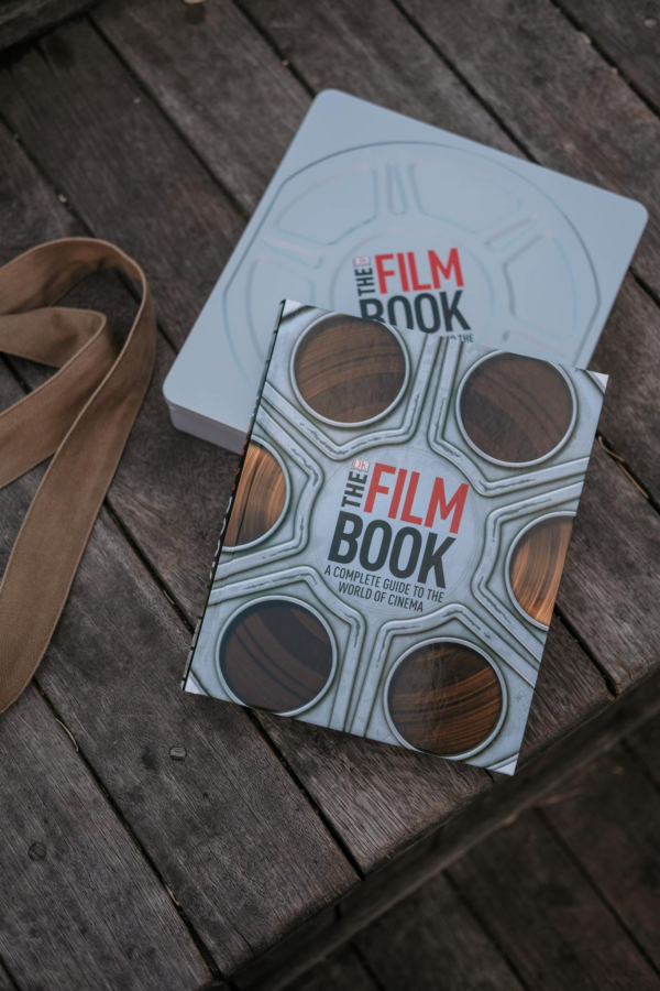 A  Film Book Laid on a Wooden Surface