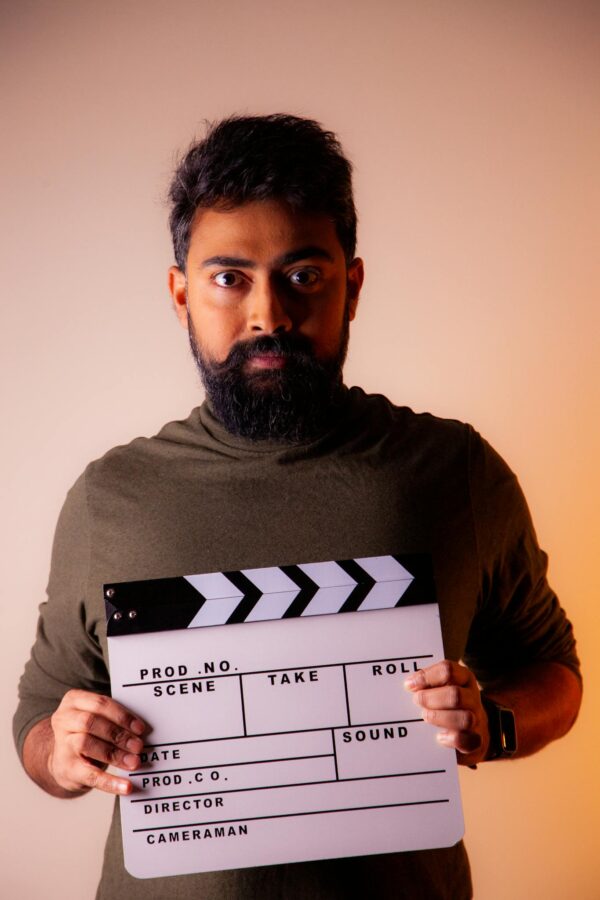 Man Holding Clapperboard