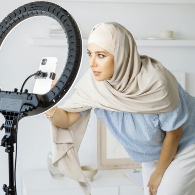 Woman in White Hijab Standing Near Black and White Drum Set