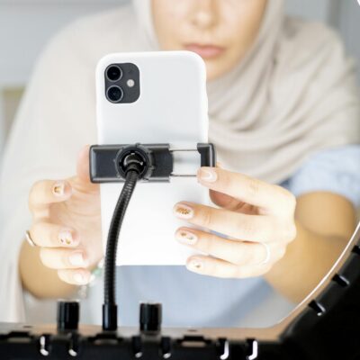 Woman in White Shirt Holding White Iphone 5 C